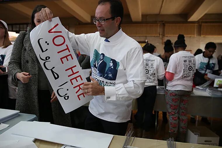 Mayor candidate Ken Trujillo makes a voting sign during the 20th annual Greater Philadelphia Martin Luther King Day of Service at Girard College in Philadelphia, Pa. on January 19, 2015.  ( DAVID MAIALETTI / Staff Photographer )
