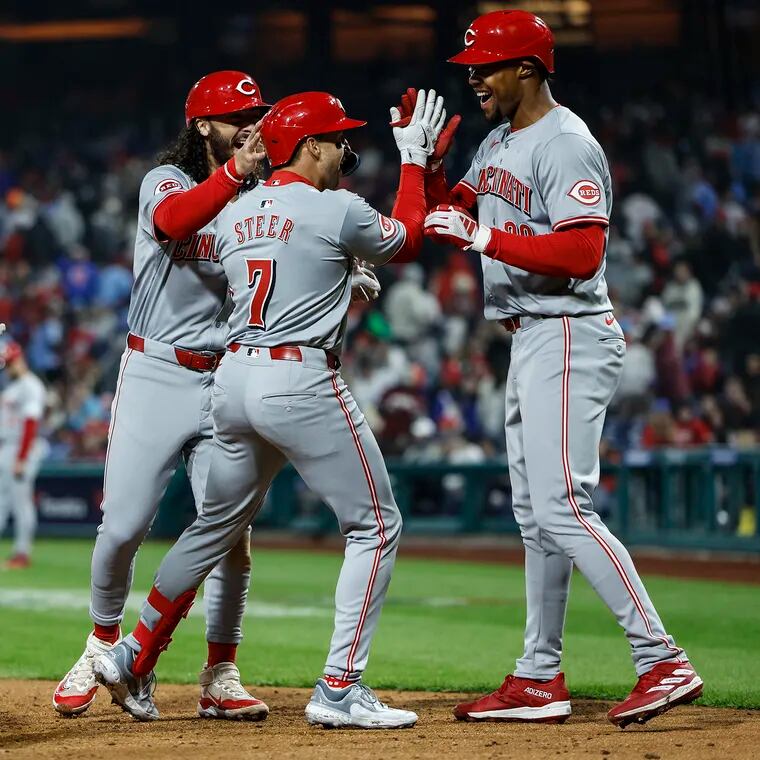 Reds Spencer Steer 7 celebrates with teammates after his Grand Slam against the Phillies during the 10th inning at Citizens Bank Park in Philadelphia, Monday, April 1, 2024 Reds beat the Phillies 6-3 in 10 innings.