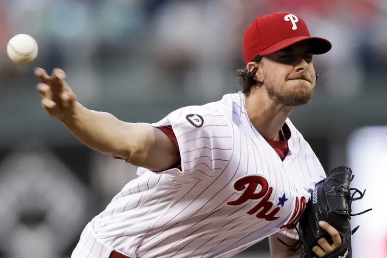 Philadelphia Phillies pitcher Aaron Nola, who finished with 10 strikeouts,  unleashes pitch against Astros during second inning.