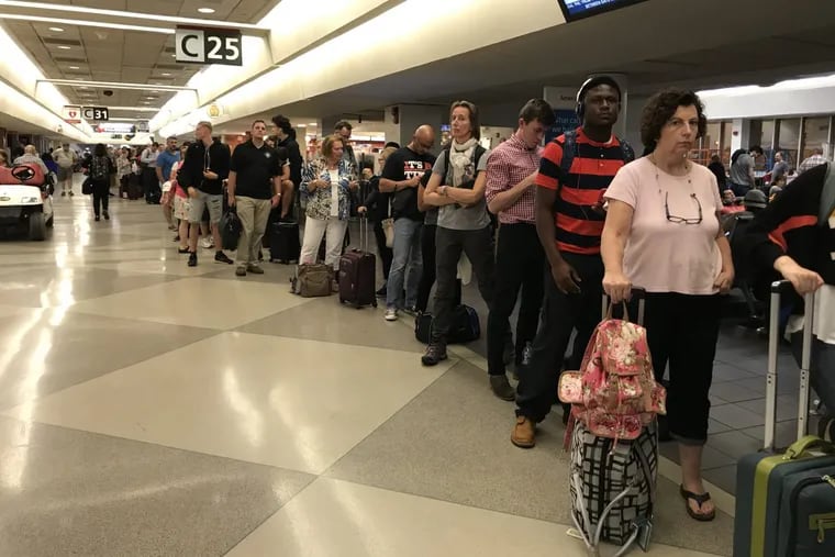 A long line for American Airlines’ customer service at the Philadelphia Airport.