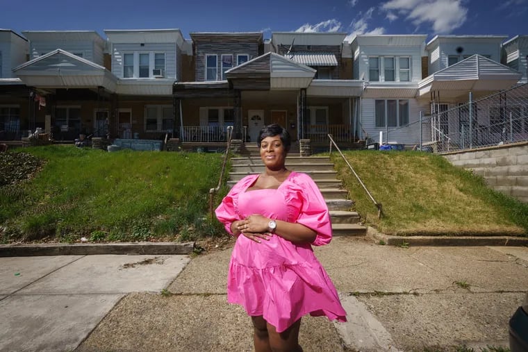 “This was always a dream of mine to buy a home," said Akirah Pressley, shown here outside her new home in Philadelphia.