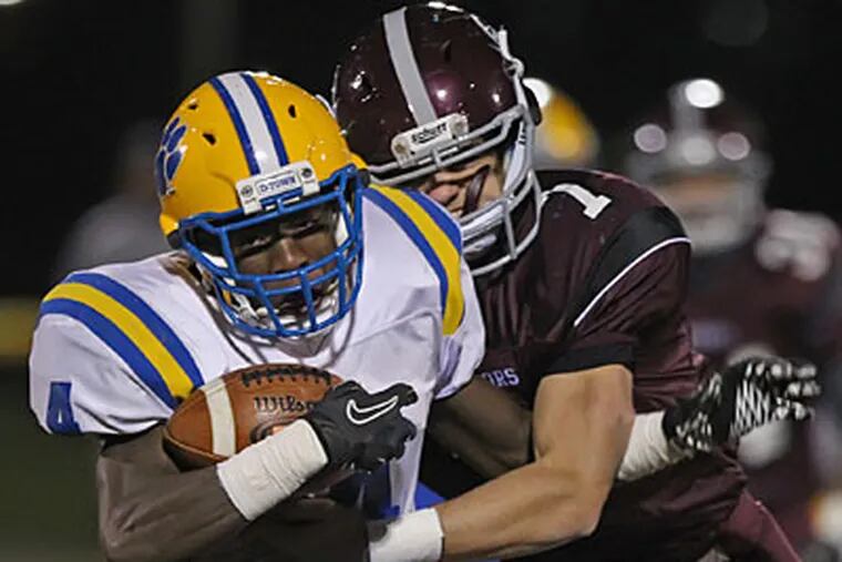 Downingtown East's Jay Harris runs for a long gain in the first quarter. (Michael Bryant/Staff Photographer)
