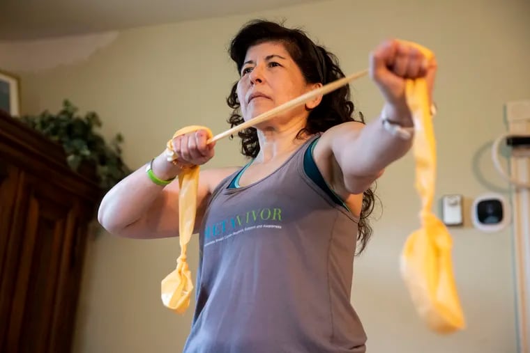 Marianne Sarcich participates in a Livestrong exercise class from her home in Wilmington. Sarcich needed tissue from one thigh to reconstruct her breast after a mastectomy and fought several insurance denials to get coverage for a procedure to make her opposite thigh the same size.