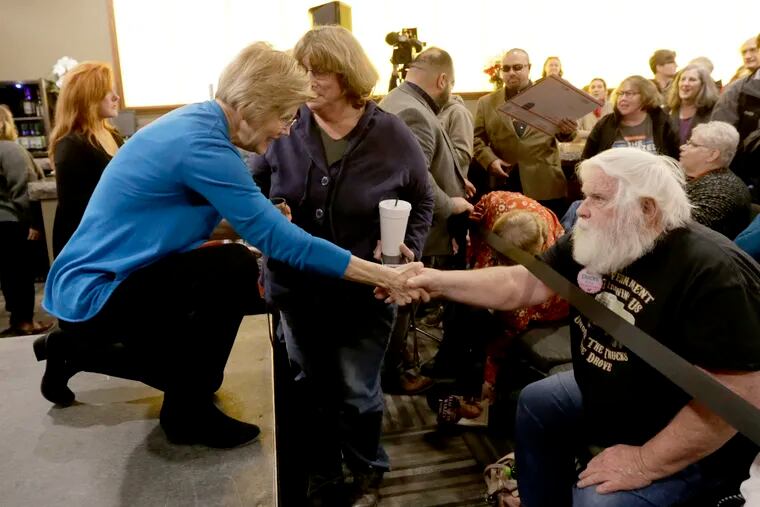Sen. Elizabeth Warren, D-Mass, shakes hands with a member of the audience following an organizing event at McCoy's Bar Patio and Grill in Council Bluffs, Iowa, Friday, Jan. 4, 2019. Warren is making her first visit to Iowa this weekend as a likely presidential candidate, testing how her brand of fiery liberalism plays in the nation's premier caucus state. (AP Photo/Nati Harnik)