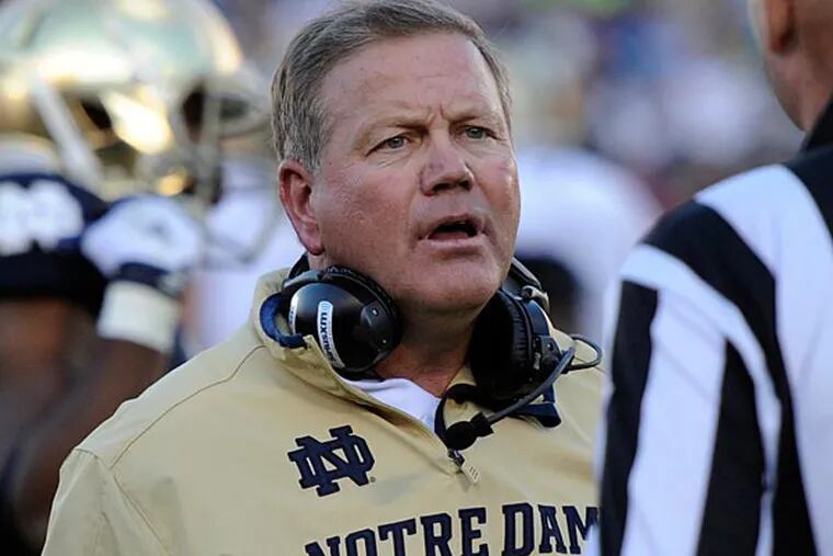 Notre Dame football coach Brian Kelly talks with a referee during the Purdue game Sept. 8, 2012 in South Bend, Ind. (AP Photo/Joe Raymond)