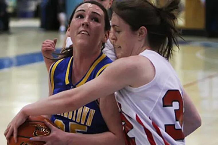 Carroll's Jen Carney forces a jump ball as Downingtown East's Kaitlyn Dougherty can't get a shot off. (Michael Bryant/Staff Photographer )