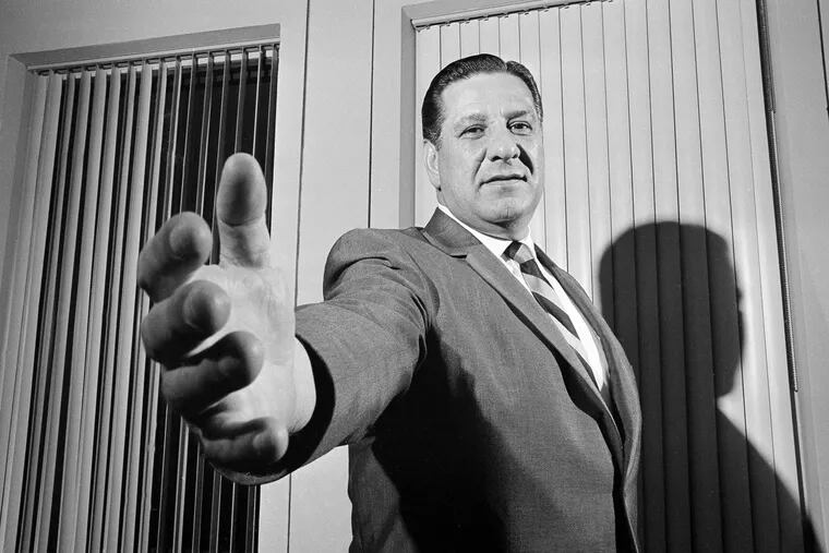 FILE - In this Jan. 3, 1968, file photo, Philadelphia Police Commissioner Frank Rizzo, later elected mayor, extends his hand to greet a visitor to his office in the Philadelphia Police Department's headquarters in Philadelphia. (AP Photo/Bill Achatz, File)