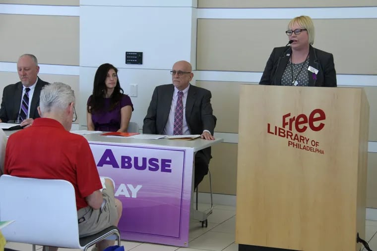 Pictured at the 2016 World Elder Abuse Awareness Day event in Philadelphia (from left) are panelists Ken Spaide, then-supervisory special agent for the U.S. Department of Homeland Security; Emily Cardin, caregiver; and Joseph Snyder, director of Older Adult Protective Services at Philadelphia Corporation for Aging. Speaking at the podium is Krista McKay, director of programs and services for the Alzheimer’s Association Delaware Valley Chapter. (Photo by Evangelina Iavarone)