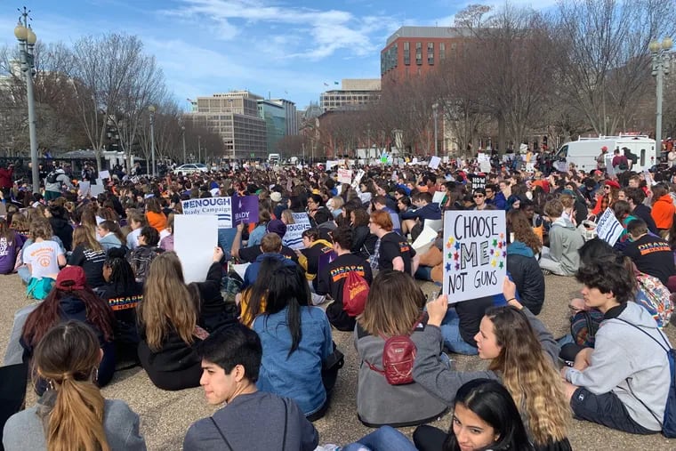 Students gather for a sit-in outside the White House on March 14 to protest inaction on gun violence more than a year after the mass school shooting in Parkland, FL.
