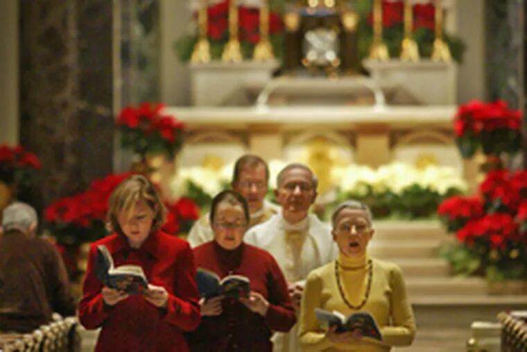 WITH CHRISTMAS Mass ended yesterday morning, the recessional begins at the Cathedral Basilica of Ss. Peter and Paul in Center City.