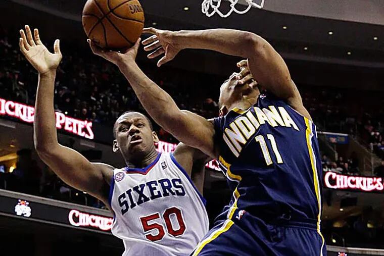 The Pacers' Orlando Johnson is fouled by the 76ers' Lavoy Allen. (Matt Slocum/AP)