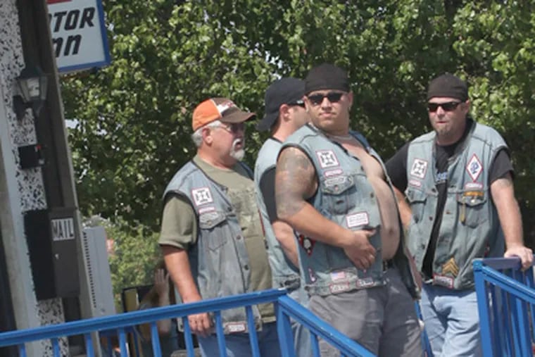 Members of the Pagan's Motorcycle Club hang out at the Binns Motor Inn, in Wildwood. (TF Garrett  / For the Daily News)