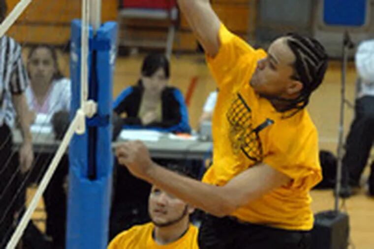 Kensington&#0039;s Hector Then goes up for a spike against Masterman as teammate Jesus Reyes watches.