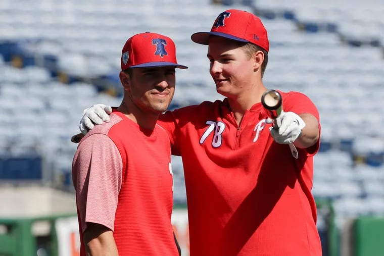 Phillies outfield prospects (from left) Adam Haseley and Mickey Moniak chatting in spring training.