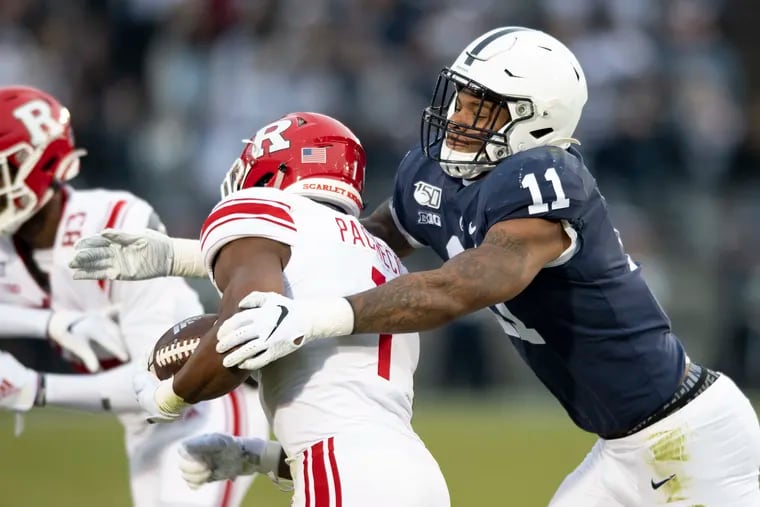 Penn State linebacker Micah Parsons (11) tackling Rutgers tight end Johnathan Lewis (11) in the first quarter Saturday.