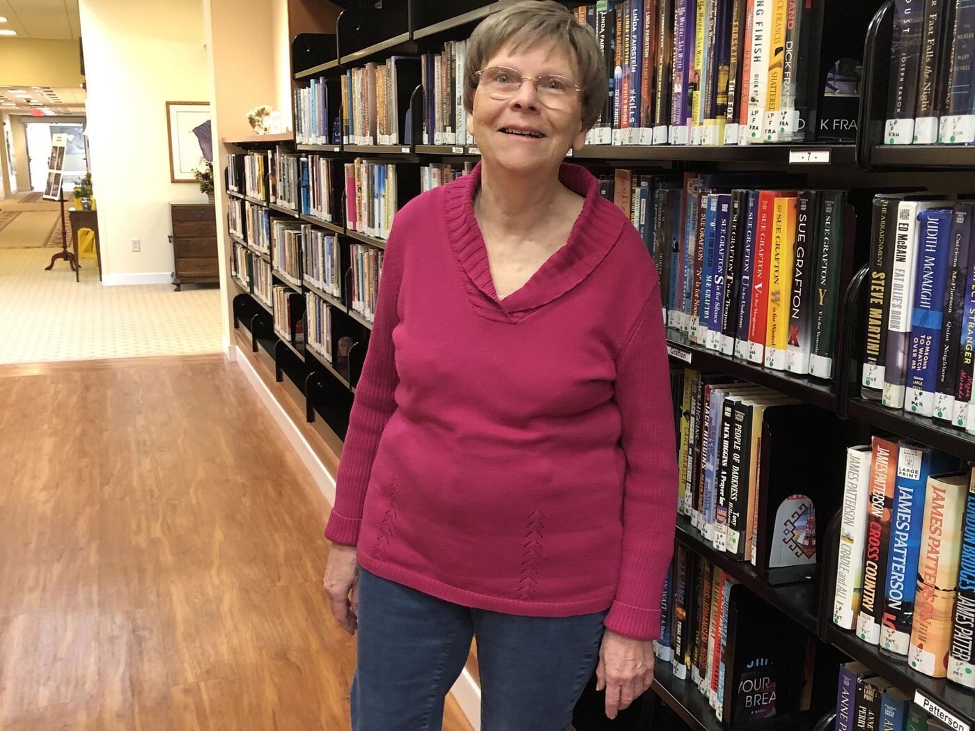 Betty Vosskaemper enjoyed the library during a tour of Pennswood Village, a retirement community in Bucks County.