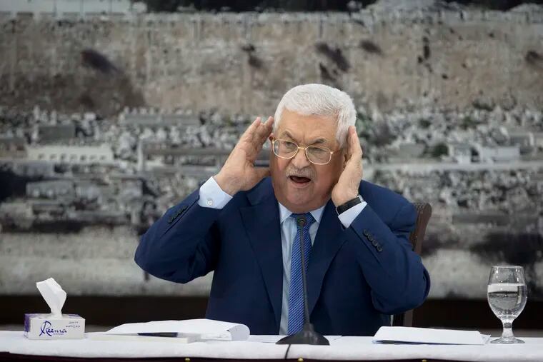 FILE - In this Dec. 22, 2018 file photo, Palestinian President Mahmoud Abbas gestures as he speaks during a meeting of the Palestinian leadership in the West Bank city of Ramallah. The Western-backed Palestinian Authority is threatening to step up pressure on Hamas amid renewed tensions in Gaza, even as Israel allows a lifeline of Qatari aid to flow directly to the Islamic militants. Abbas wants to reassert his authority over Gaza, while Israeli Prime Minister Benjamin Netanyahu seeks to preserve calm ahead of April's elections. (AP Photo/Majdi Mohammed, File)