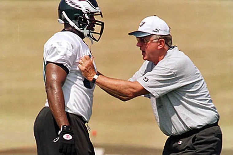 In 1999, Jim Johnson (right), as the Eagles new defensive coordinator, worked with Antonio London during camp at Lehigh University. Johnson' is credited with the Eagles ensuing defensive rise.