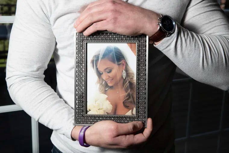Ronnie Lomonaco’s wife Michele died unexpectedly. Since November, someone has anonymous, except for leaving cards as “Michele’s Angel,” has been doing acts of kindness in her name and telling the people to let him know. He is shown with a photo of Michele on April 22.
