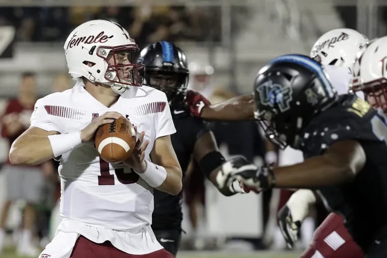 Temple quarterback Anthony Russo looks for a receiver as he is pressured by the Central Florida defense during the first half of an NCAA college football game Thursday, Nov. 1, 2018, in Orlando, Fla. (AP Photo/John Raoux)