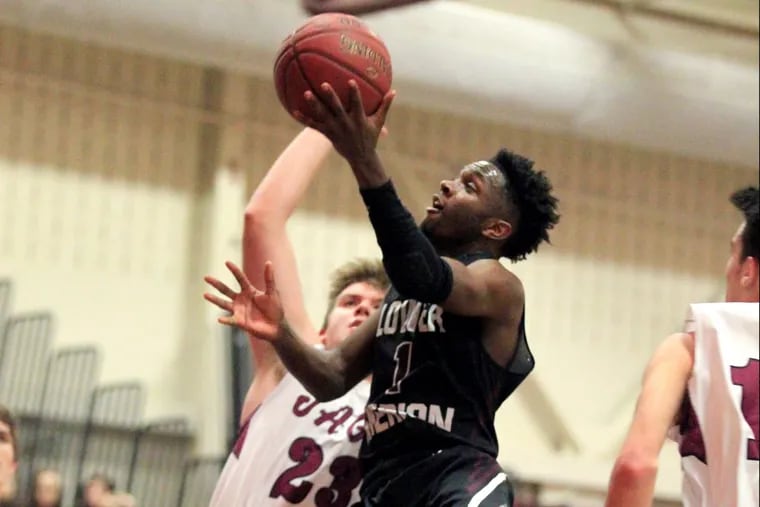 Lower Merion’s Steve Payne drives to the basket in Tuesday’s 75-68 win over Central League rival Garnet Valley.