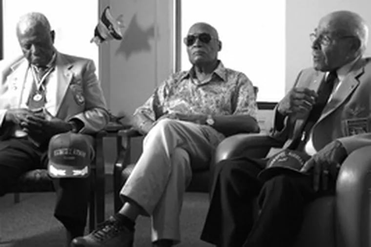 Reliving their days as Tuskegee Airmen are (from left) Eugene Richardson, John L. Harrison and Bertram Levy. Their country&#0039;s disdain during World War II did not weaken their patriotism.
