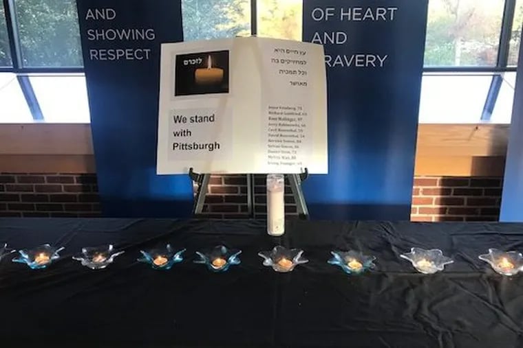Students and staff at the Jack M. Barrack Hebrew Academy organized a ceremony Monday morning to honor those killed by a gunman in a Pittsburgh synagogue on Saturday. The candles represent each of the 11 people who died at the Tree of Life Synagogue.