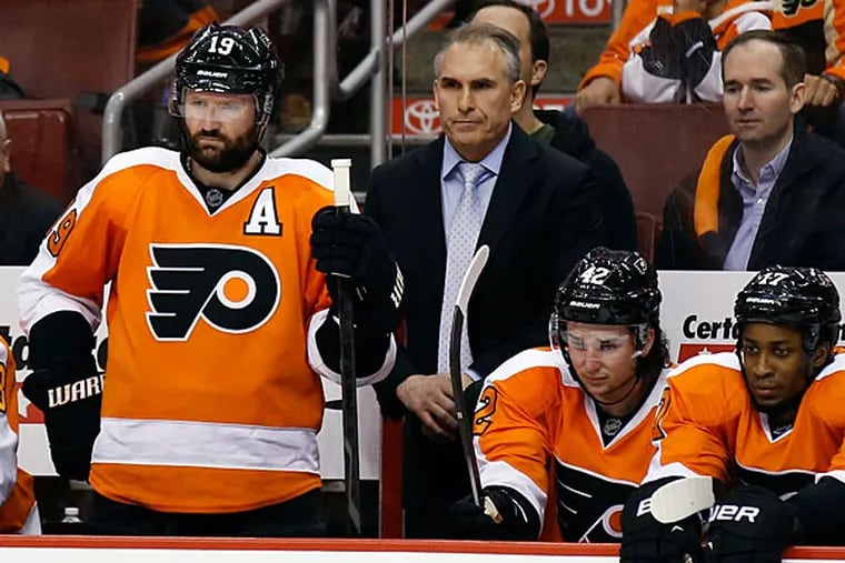 Flyers head coach Craig Berube stands on the Flyers bench. (Yong Kim/Staff Photographer)