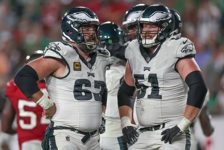 Philadelphia Eagles center Jason Kelce stands next to Philadelphia Eagles center Cam Jurgens after their win over the Tampa Bay Buccaneers in Tampa, Fla., on Monday, Sept. 25, 2023.