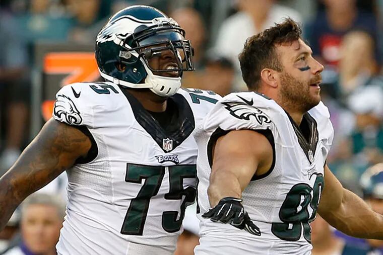 The Eagles' Connor Barwin celebrates a stop with teammate Vinny Curry.