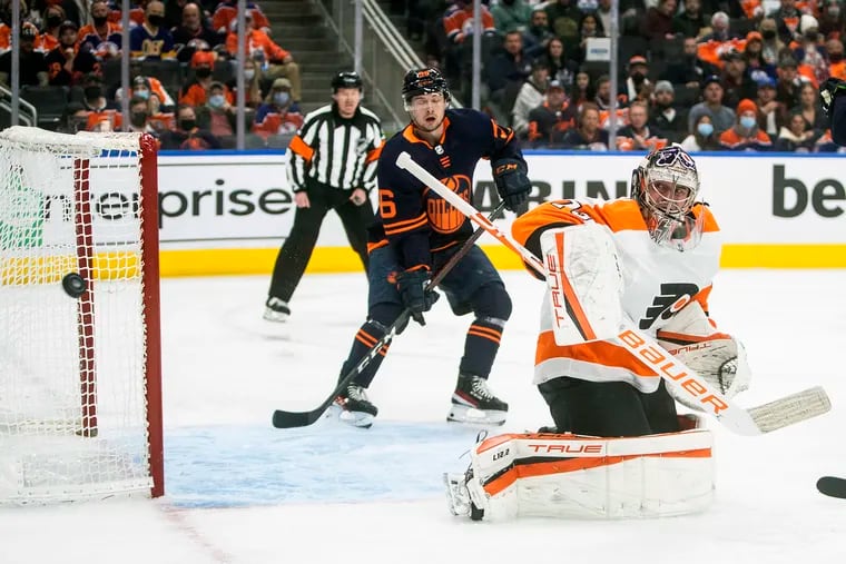 Flyers goalie Carter Hart makes the save as the Edmonton Oilers' Kailer Yamamoto (56) looks for the rebound during the second period.