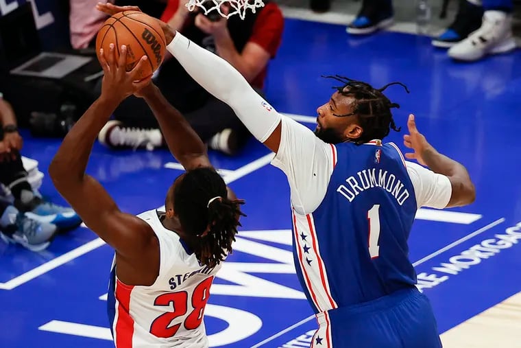 Sixers center Andre Drummond blocks Detroit's Isaiah Stewart during the first quarter of Friday's preseason finale.