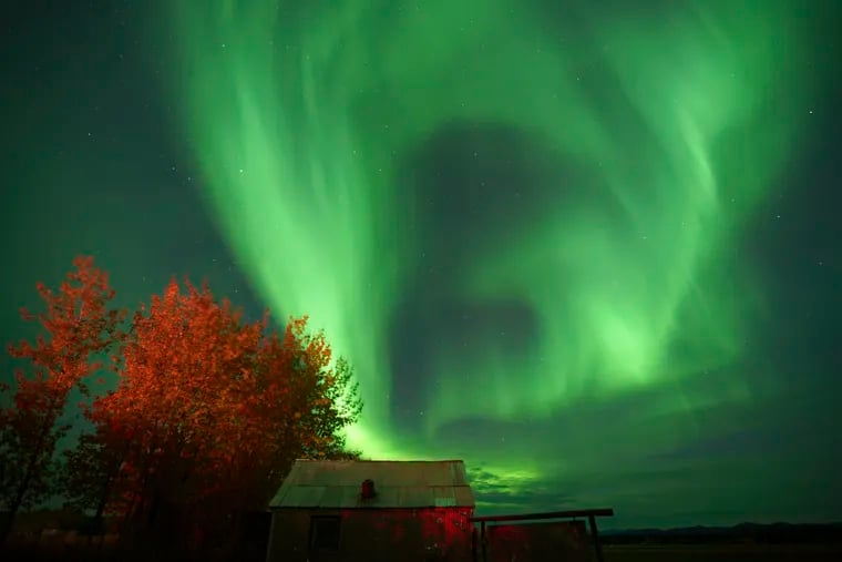 Northern lights animate the night sky in September 2022 in Bettles, Alaska. Auroras may be seen much farther south this weekend.