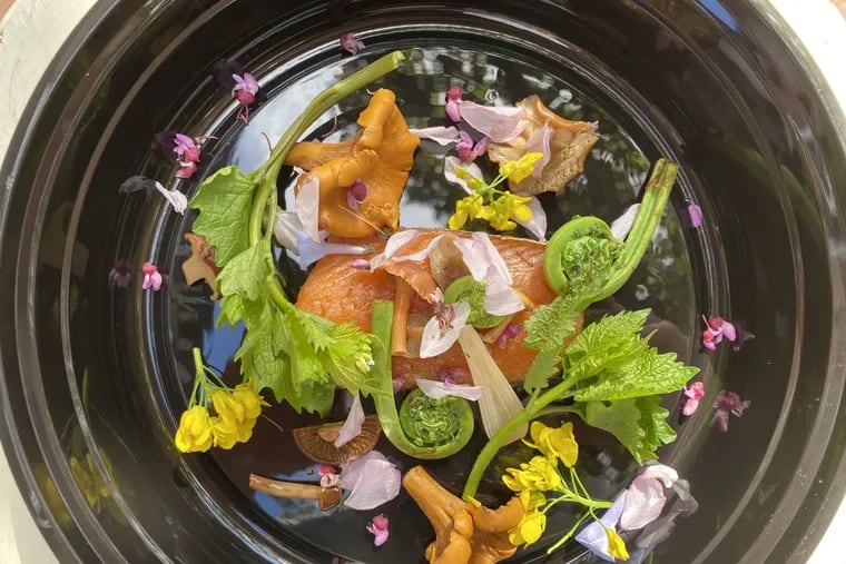 Hot smoked trout with foraged fiddlehead ferns, mushrooms, and flowers at Andiario.