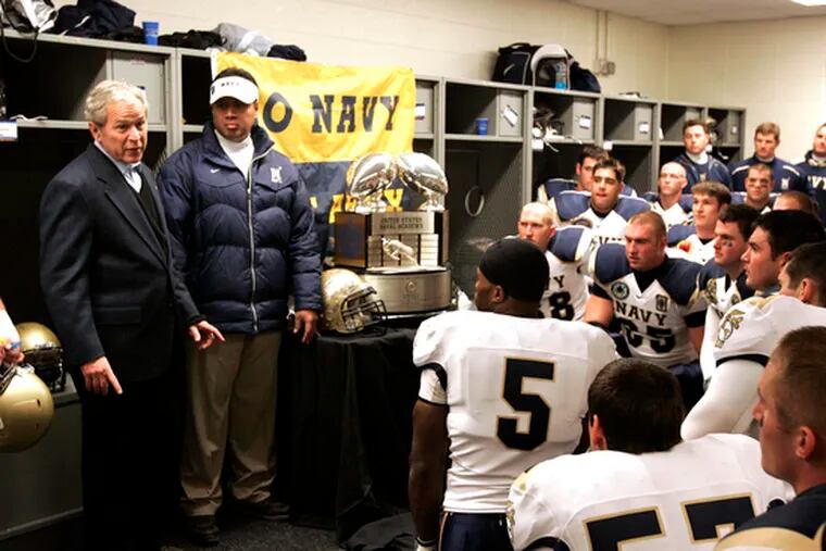 President Bush talks to the Navy team in its locker room before the 109th Army-Navy football game at Lincoln Financial Field. Navy won, 34-0, for its seventh straight victory in the series.
