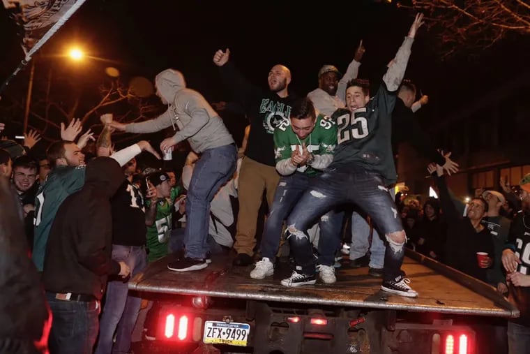 After celebration —  as these Eagles fans did on Broad Street near Shunk in South Philly after Sunday’s victory over the Vikings — comes Super Bowl wagers and bets.