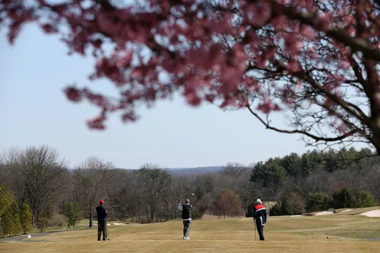 People play golf at the Bella Vista Golf Course in Gilbertsville, Pa., on Wednesday, March 18, 2020. The course is not closed despite the ongoing coronavirus pandemic.