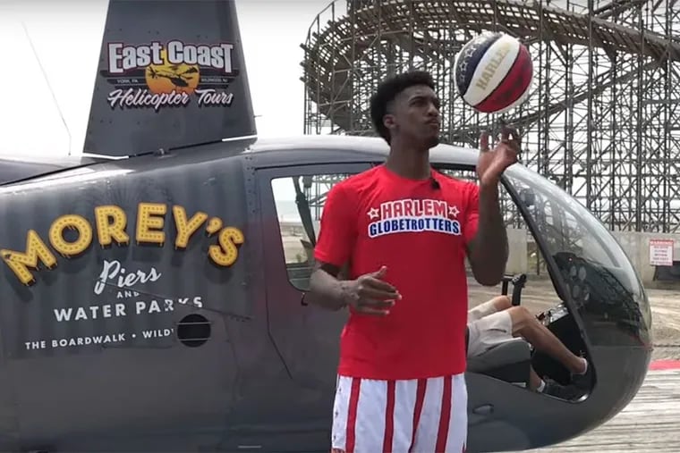 Bull Bullard before shooting a basketball into a hoop from more than 200 feet in the air.
