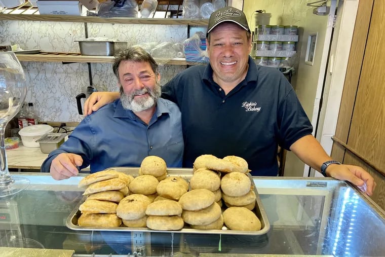 Paul Spangler (left) and Steven Nawalany with knishes at Lipkin's Best Bakery, 7594 Haverford Ave.