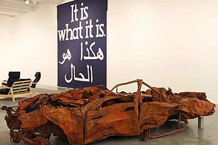 A wrecked car exhibited by Jeremy Deller is part of &quot;It Is What It Is,&quot; outside the Constitution Center from 10 a.m. to 4 p.m. today.