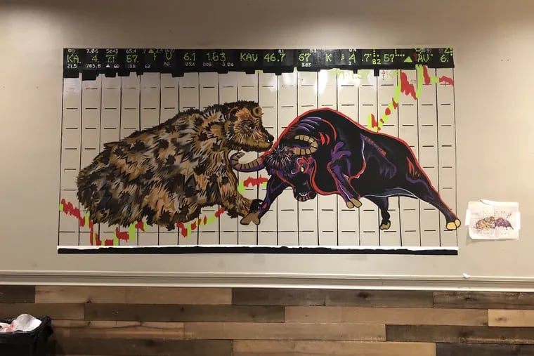 A bull and bear-theme mural, reflecting the owners' background in finance, is a work in progress at the new location of Swiss Haus, 1740 Sansom St.