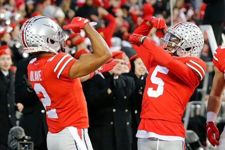 Ohio State receiver Garrett Wilson, right, celebrating his touchdown against Purdue with teammate Chris Olave during a game Nov. 13, 2021, in Columbus, Ohio.