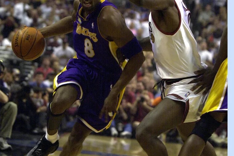 SIXR14rc9, 6/13/01,NBA FINALS, GAME FOUR, Philadelphia, PA--June 13, 2001--Lakers at Sixers Game 4 of the NBA Finals:  LA Laker Kobe Bryant drives past Sixer  Aaron McKie  during first quarter action at the First Union Center. Photo by Ron .Cortes/The Philadelphia Inquirer
