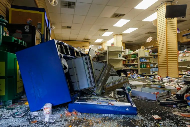 The damage from vandalism is seen inside SunRay Drugs at South 52nd and Walnut Streets on Wednesday, Sept. 27, 2023. The unrest stretched across the city, including Center City, the Northeast, and West Philadelphia, with business corridors along Aramingo Avenue and Walnut Street targeted through the night.