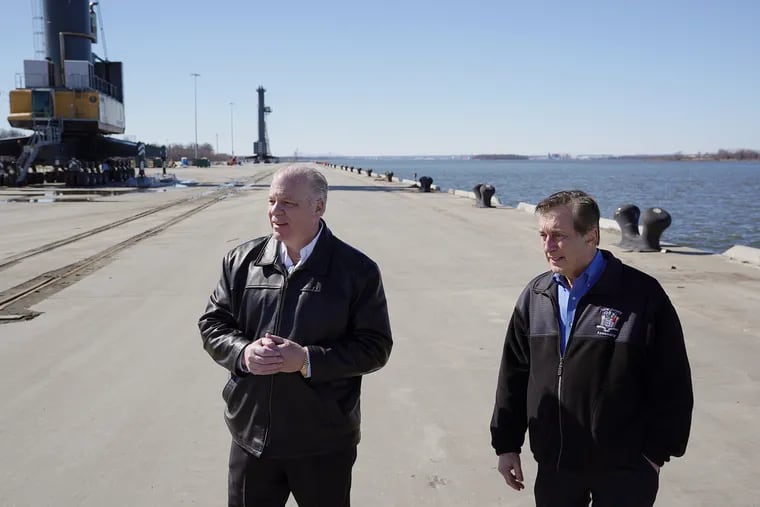 New Jersey State Senate President Steve Sweeney (left) and Assemblyman John J. Burzichelli at the Paulsboro Marine Terminal in Paulsboro. The port, built on the site of a former oil terminal, will soon be home to a manufacturing facility for the German company EEW to build monopiles for offshore wind turbines.