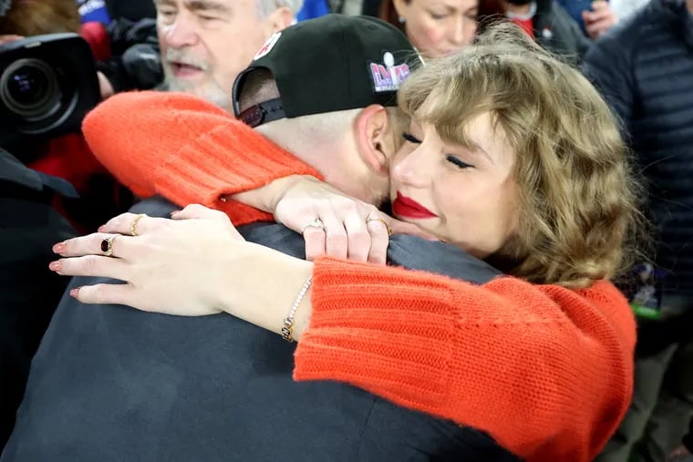 Swifties got their first peek at the custom tennis bracelet Travis Kelce gave to girlfriend Taylor Swift during this hug Jan. 28 after the Kansas City Chiefs' AFC Championship win over the Baltimore Ravens. The bracelet features the letters TNT.