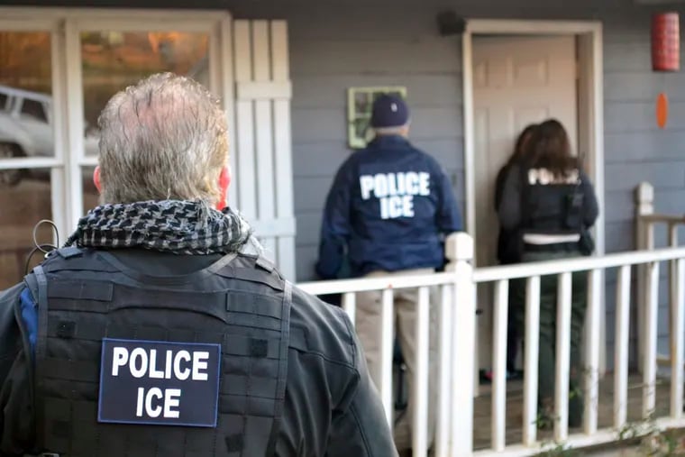 In this Feb. 9, 2017, photo provided U.S. Immigration and Customs Enforcement, ICE agents at a home in Atlanta, during a targeted enforcement operation aimed at immigration fugitives, re-entrants and at-large criminal aliens. The Homeland Security Department said Feb. 13, that 680 people were arrested in roundups last week targeting immigrants living illegally in the United States.