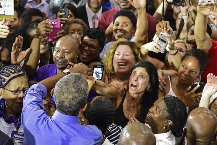 Former President Barack Obama is headlining a Democratic rally in Philadelphia on Friday. Here, he shakes hands with members of the audience after a campaign even in Cleveland Sept. 13.
