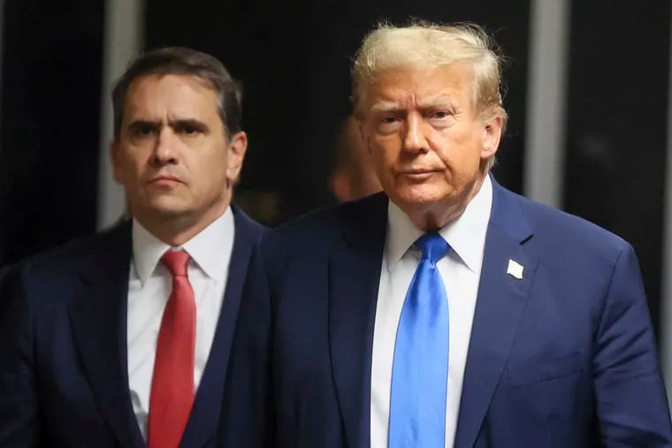 Republican presidential candidate and former U.S. President Donald Trump walks next to his attorney Todd Blanche, at Manhattan state court in New York on Monday.