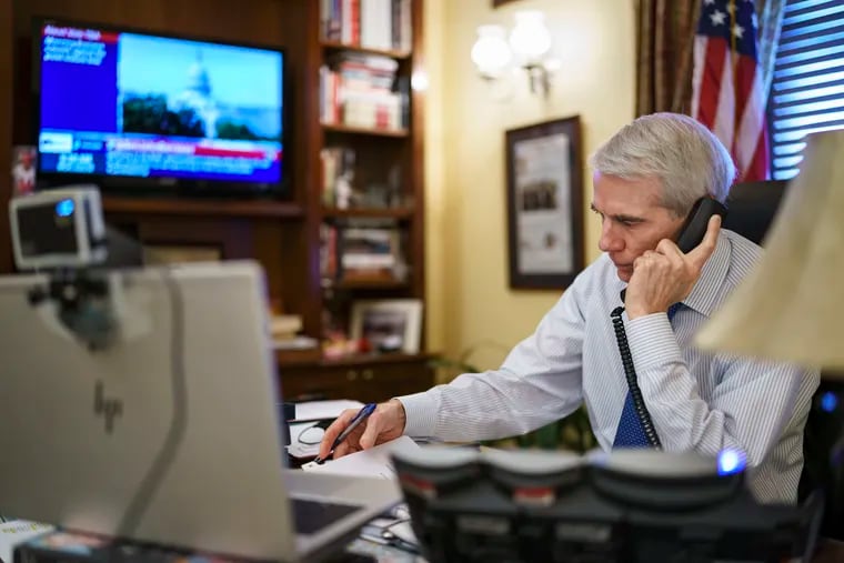 Sen. Rob Portman of Ohio, the top Republican negotiator on the bipartisan infrastructure bill, works from his office on Capitol Hill on Monday.